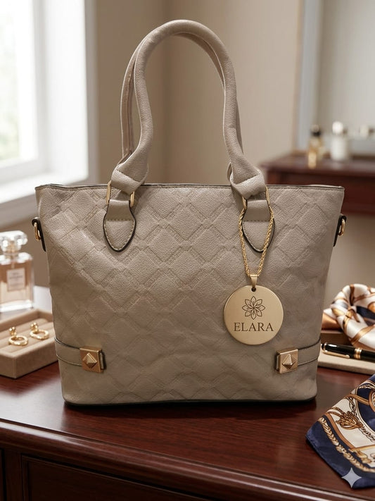 Beige quilted handbag with 'ELARA' tag on a wooden surface