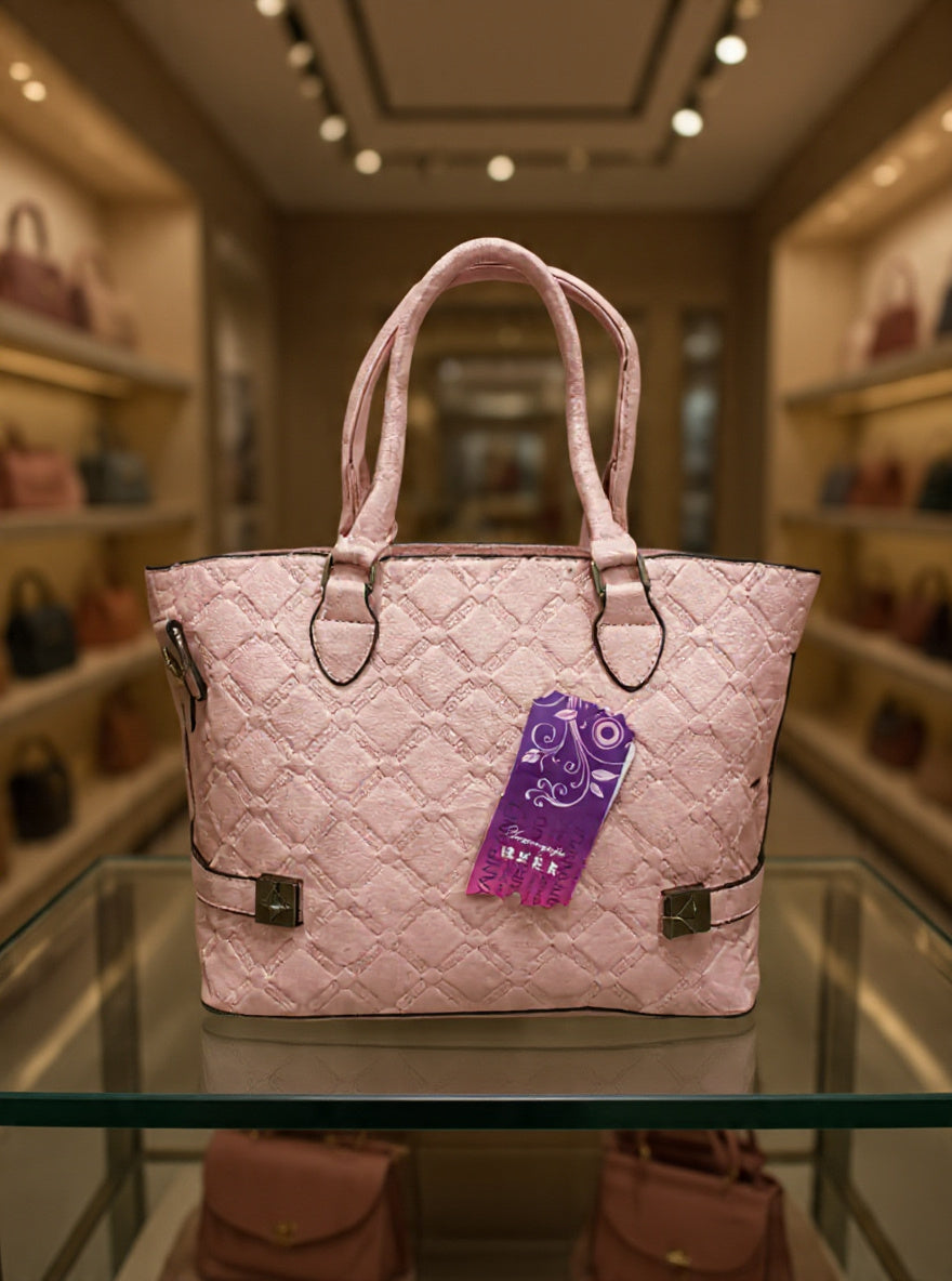 Pink quilted handbag with a purple tag on a glass surface in a store setting