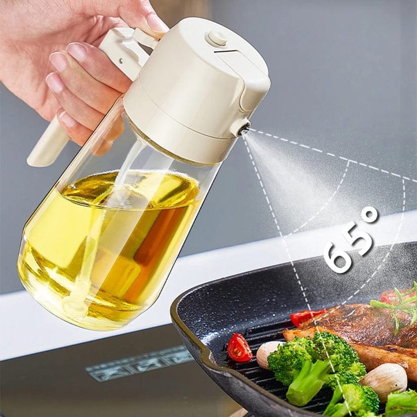 Oil sprayer being used over a grill with food, showing oil spray and temperature indication.